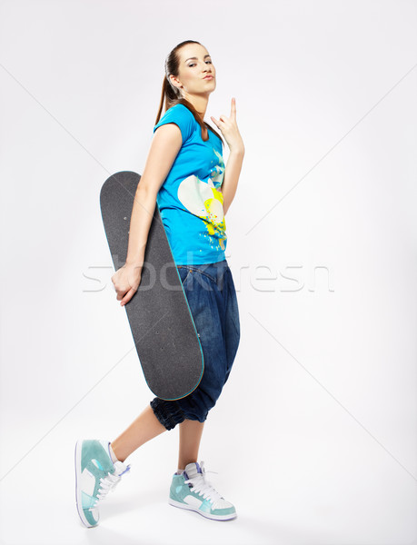 Ragazza skateboard ritratto bella estrema grigio Foto d'archivio © zastavkin