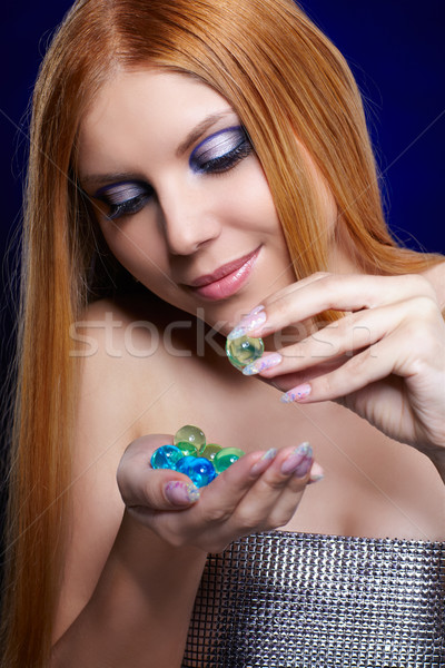 redhead girl with gel balls Stock photo © zastavkin