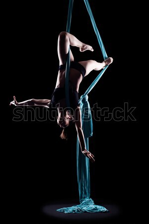 Young woman gymnast with blue gymnastic ribbon Stock photo © zastavkin