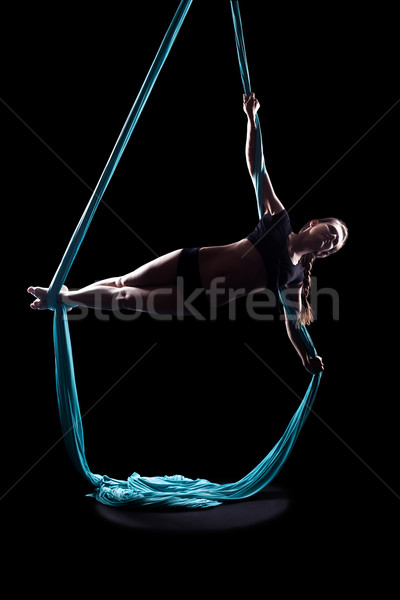 Young woman gymnast with blue gymnastic ribbon Stock photo © zastavkin