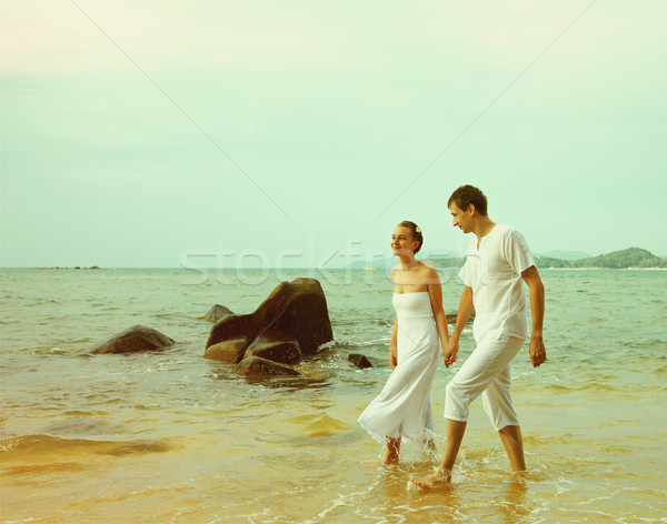 Instagram colorized vintage couple on beach portrait Stock photo © zastavkin