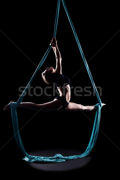 Young woman gymnast with blue gymnastic ribbon Stock photo © zastavkin