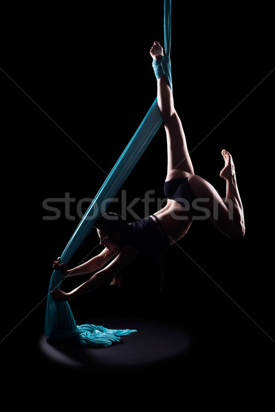 Young woman gymnast with blue gymnastic ribbon Stock photo © zastavkin