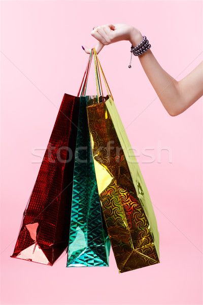 hand with shopping bags Stock photo © zastavkin