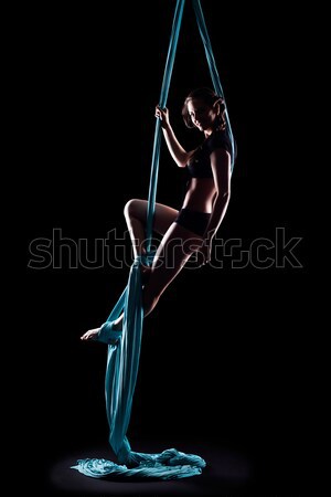 Young woman gymnast with blue gymnastic ribbon Stock photo © zastavkin