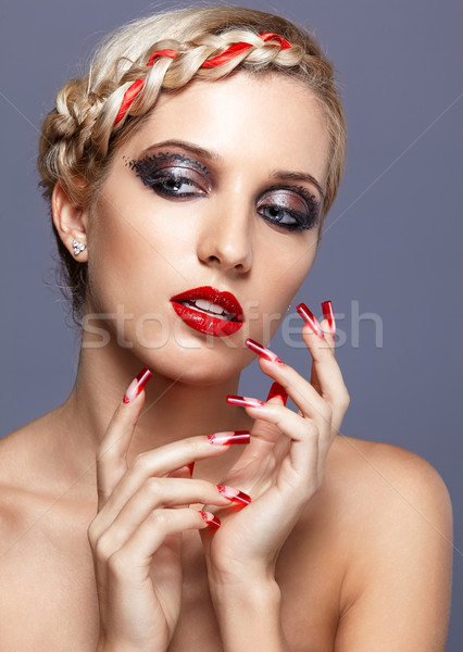 Young woman with red nails Stock photo © zastavkin