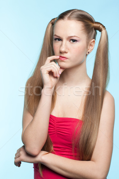 Freckled girl in red dress Stock photo © zastavkin