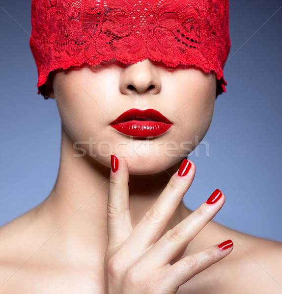 woman with red lacy ribbon on eyes Stock photo © zastavkin