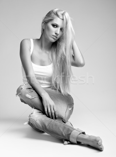 Femme blonde jeans gilet monochrome portrait [[stock_photo]] © zastavkin