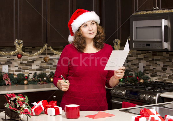 Femme écrit heureux Noël [[stock_photo]] © zdenkam