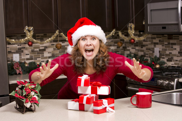 thrilled woman during Christmas Stock photo © zdenkam