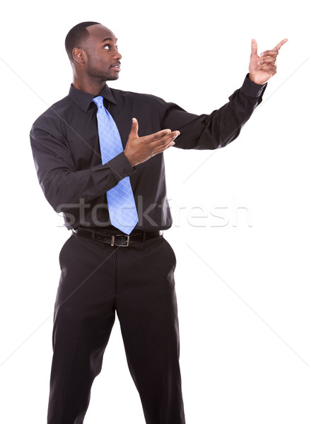 handsome black man pointing Stock photo © zdenkam