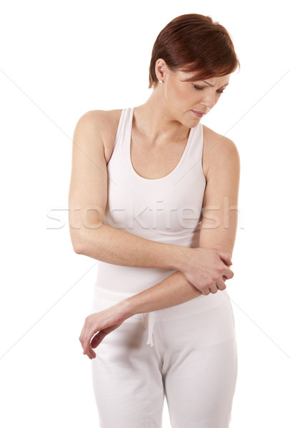 Nő könyök fájdalom visel fehér lány Stock fotó © zdenkam