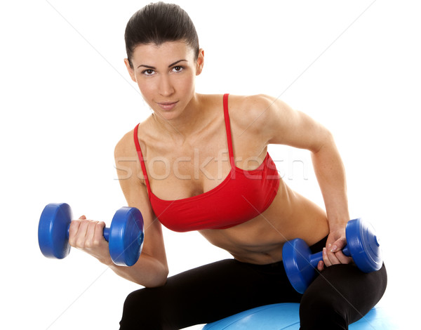 Fitness donna bruna pesi bianco Foto d'archivio © zdenkam