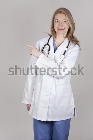 Kobiet lekarza blond stwarzające biały odizolowany Zdjęcia stock © zdenkam