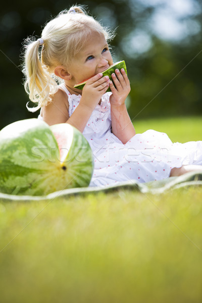 Stock photo: portrait of a little girl eating watermelon