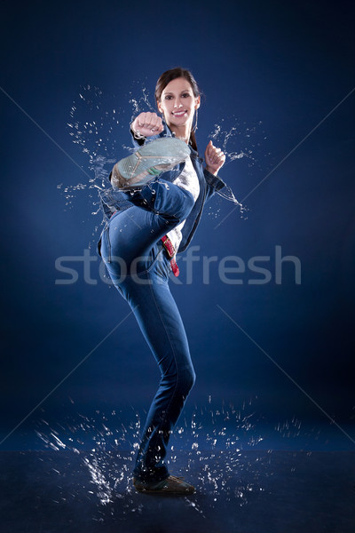 kicking woman Stock photo © zdenkam