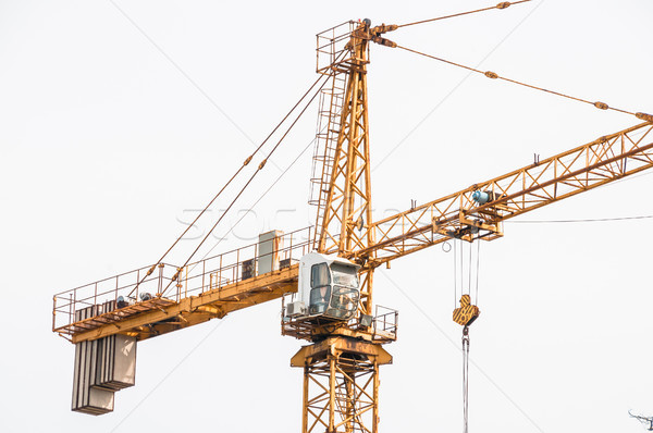 Cab lifting crane in the construction site. Stock photo © zeffss