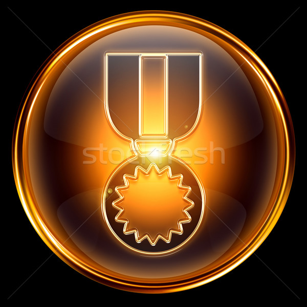 Stock photo: medal icon golden, isolated on black background.