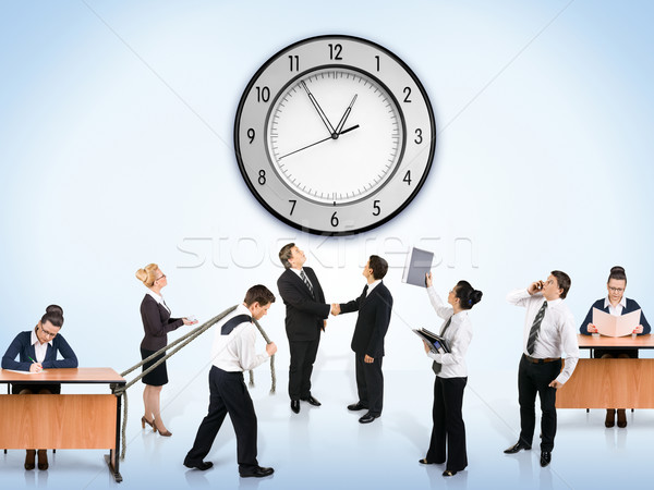 Business team vrouw muur klok werk zakenman Stockfoto © zeffss