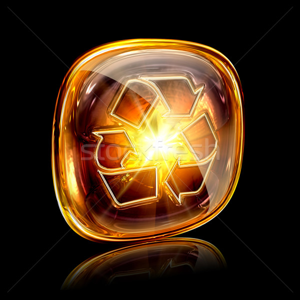 Stock photo: Recycling symbol icon amber, isolated on black background.