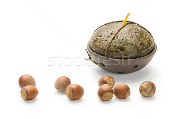 Stock photo: Hazelnuts and Candle, isolated on white background