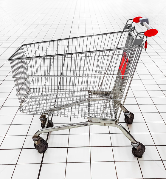 An empty shopping trolley in a supermarket. Stock photo © zeffss