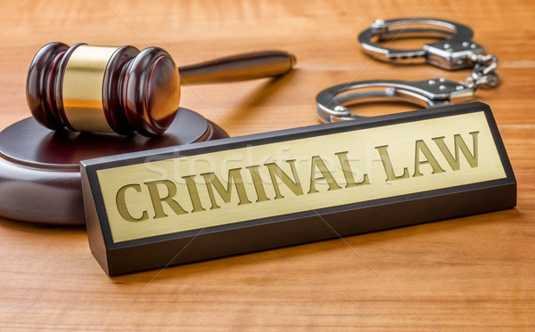 A gavel and a name plate with the engraving Criminal Law Stock photo © Zerbor