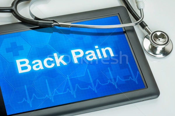 Tablet with the diagnosis back pain on the display Stock photo © Zerbor