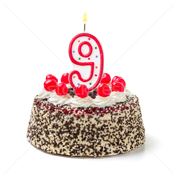 Birthday cake with burning candle number 9 Stock photo © Zerbor
