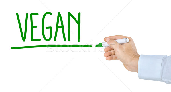 Hand with pen writing the word Vegan Stock photo © Zerbor