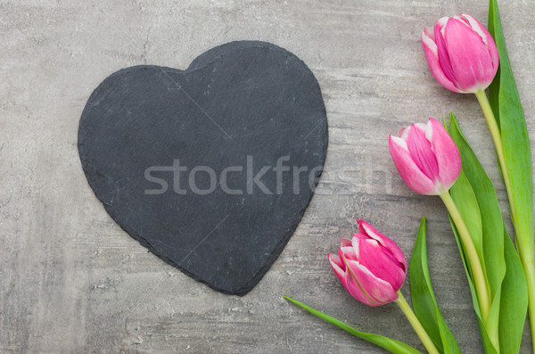 Pink Tulips with an empty heart-shaped sign Stock photo © Zerbor