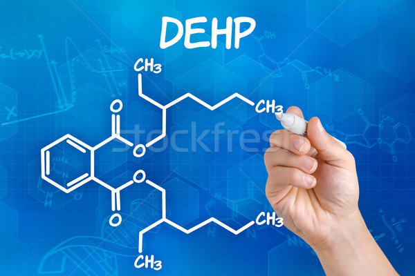 Hand with pen drawing the chemical formula of DEHP Stock photo © Zerbor