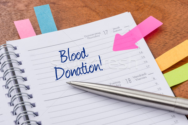 Daily planner with the entry Blood donation Stock photo © Zerbor