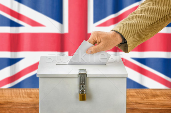 Man putting a ballot into a voting box - United Kingdom Stock photo © Zerbor