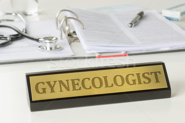 Name plate on a desk with the engraving Gynecologist Stock photo © Zerbor