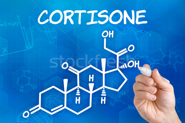 Hand with pen drawing the chemical formula of cortisone Stock photo © Zerbor