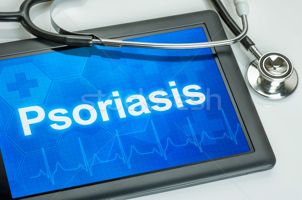 Tablet with the diagnosis Psoriasis on the display Stock photo © Zerbor