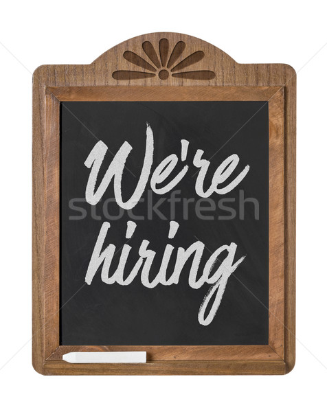 A chalkboard sign on a white background - We are hiring Stock photo © Zerbor