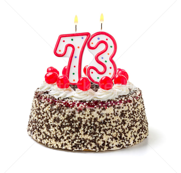 Birthday cake with burning candle number 73 Stock photo © Zerbor