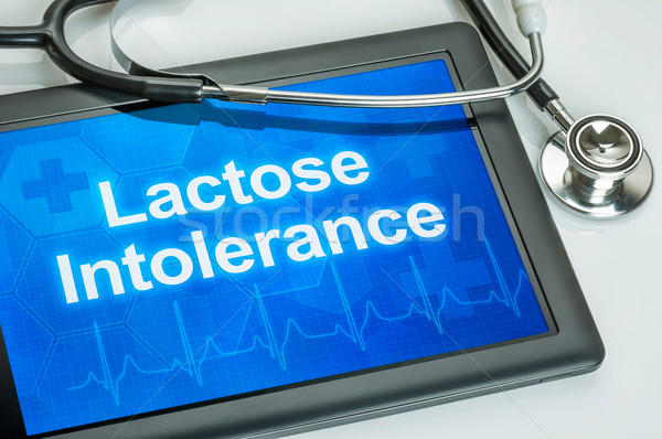 Tablet with the diagnosis lactose intolerance on the display Stock photo © Zerbor