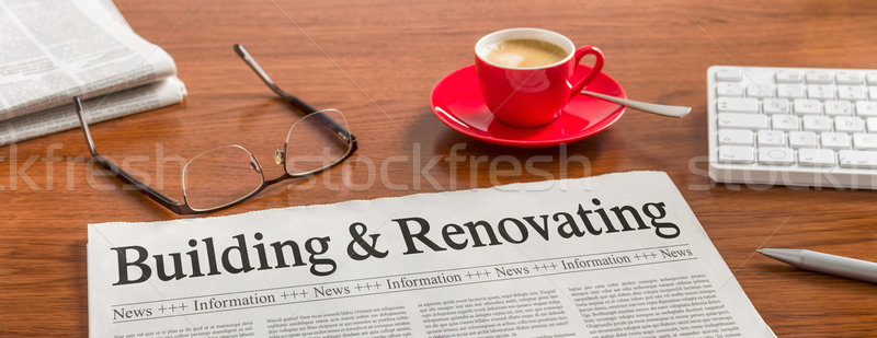 A newspaper on a wooden desk - Building and Renovating Stock photo © Zerbor