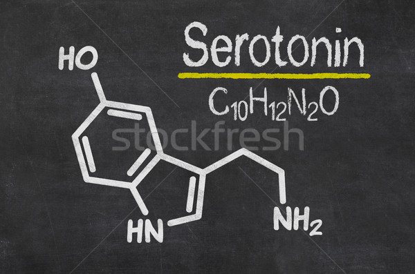 Blackboard with the chemical formula of serotonin Stock photo © Zerbor