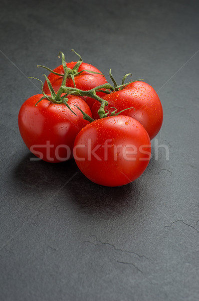 tomatoes on slate plate Stock photo © Zerbor