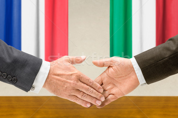 Representatives of France and Italy shake hands Stock photo © Zerbor