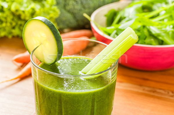 Green smoothie with fresh vegetables on a wooden background Stock photo © Zerbor