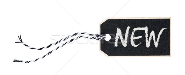 Black tag on a white background with the text New Stock photo © Zerbor