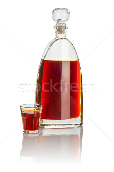 Carafe and beveled shot glass filled with brown liquid Stock photo © Zerbor