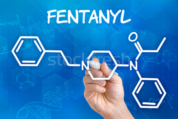 Hand with pen drawing the chemical formula of fentanyl Stock photo © Zerbor