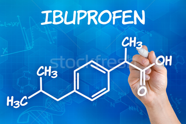 Hand with pen drawing the chemical formula of ibuprofen Stock photo © Zerbor